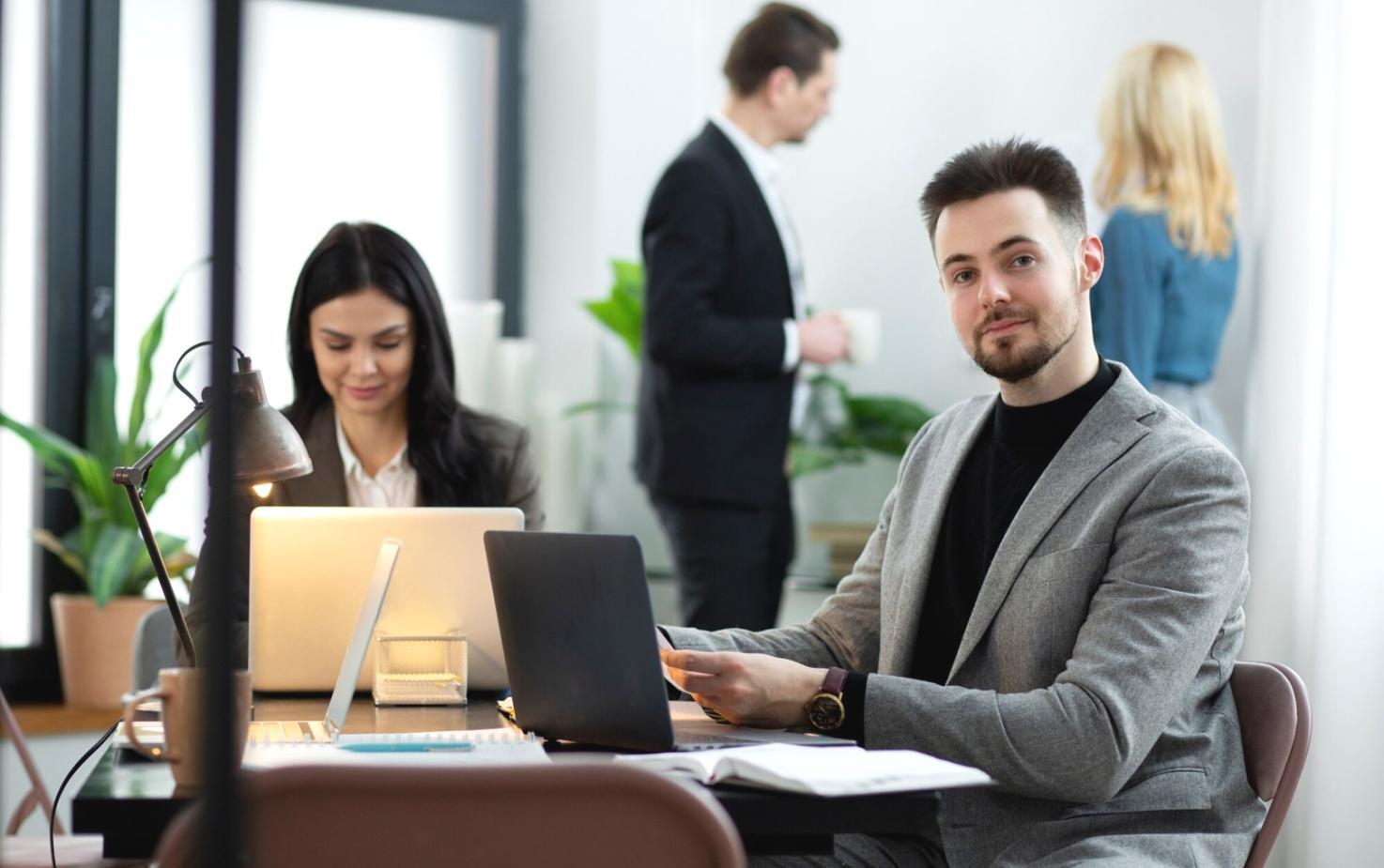 Investment professionals reviewing market data and teaching materials